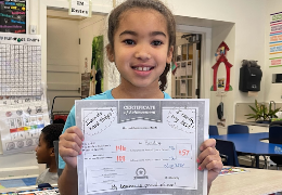 Rowland student holds iReady certificate