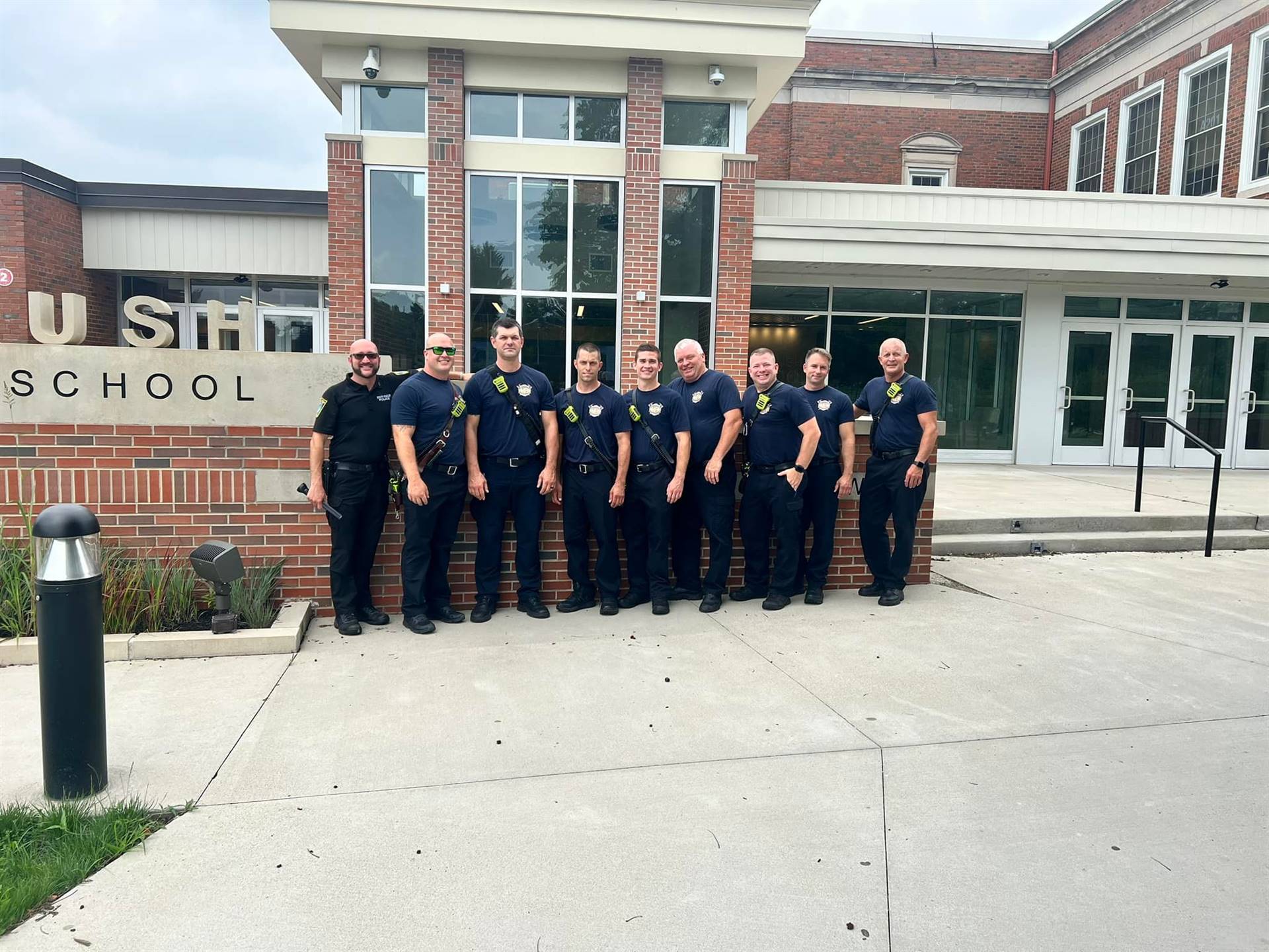South Euclid Firefighters and SRO/SE Police Officer Joe DiLillo in front of Brush HS
