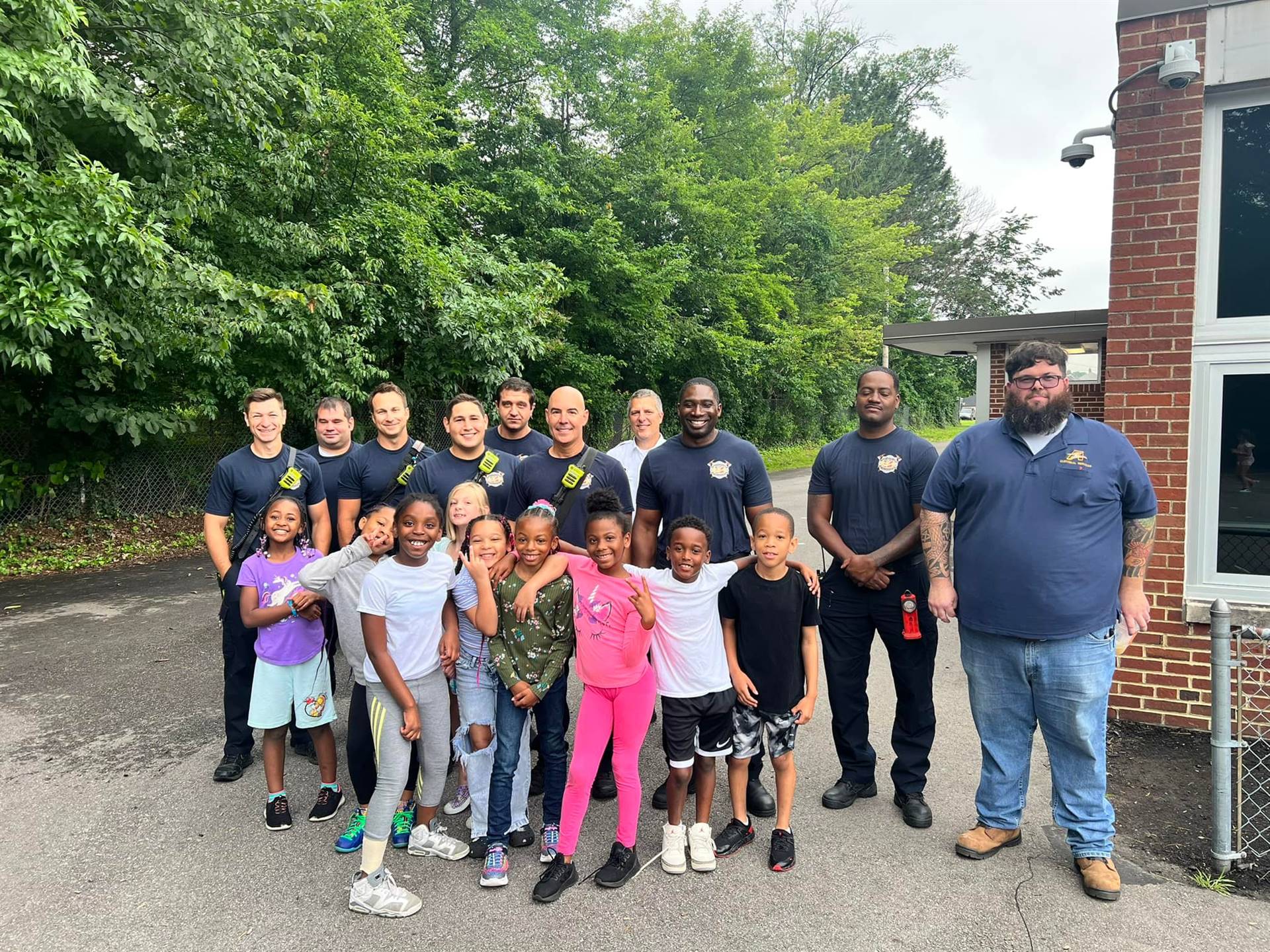South Euclid Firefighters with SEL Students and Maintenance Staff outside their school building duri